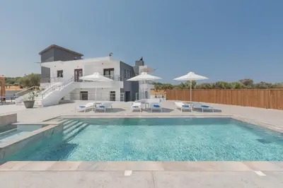 a swimming pool in front of a house at Casa Del Silencio in Pastida