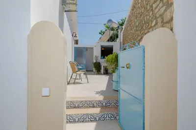 a blue door on the side of a building at Statis House in Lardos