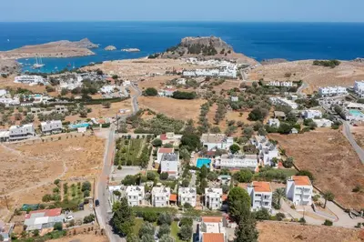 an aerial view of a small town with the ocean at Le Soleil De Lindos - Luxury Villa with Swim Spa in Líndos