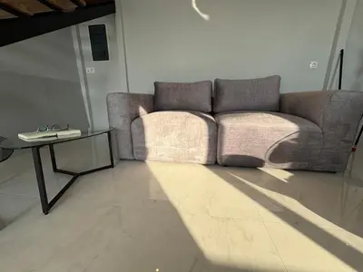 a living room with a couch and a table at Kyra Maria 3, Loft in Rhodes Town