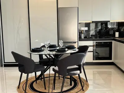 a dining table with chairs and wine glasses on it in a kitchen at Kyra Maria 3, Loft in Rhodes Town