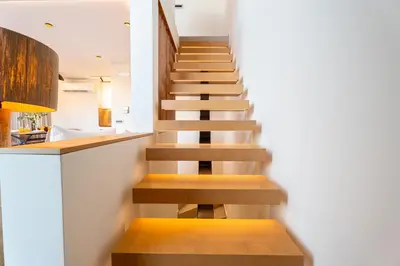 a staircase in a house with wooden steps at Etheras 2 - Holiday Apartments in Asgourou