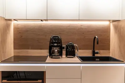 a kitchen counter with a sink and a tea kettle at Etheras 2 - Holiday Apartments in Asgourou