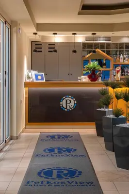 a lobby with a reception desk with araxahoahoahoahoahoahoaho at Pefkos View Suites & Maisonette in Pefki Rhodes
