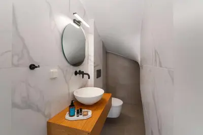 a bathroom with a sink and a mirror at Gioiello Villa in Pefki Rhodes