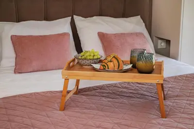 a tray of fruit on a table on a bed at Paradissia Luxe Villa with Private Swimming Pool in Paradeísion