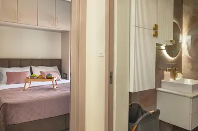 a bedroom with a bed with a table on it at Paradissia Luxe Villa with Private Swimming Pool in Paradeísion