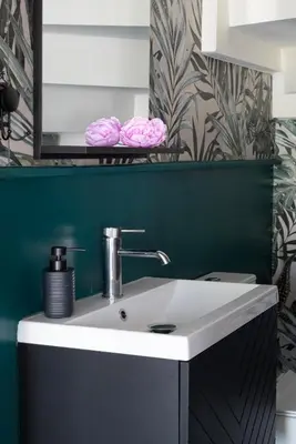 a bathroom with a white sink and a green wall at Paradissia Luxe Villa with Private Swimming Pool in Paradeísion