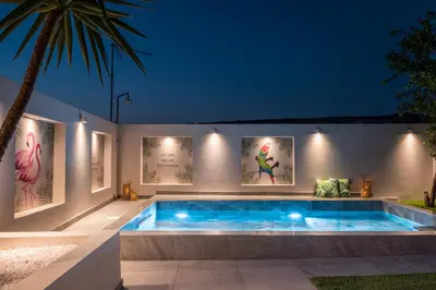 a swimming pool in a backyard at night at Paradissia Luxe Villa with Private Swimming Pool in Paradeísion