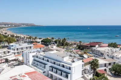 an aerial view of a city and the ocean at Ermou 44 City Hotel in Faliraki