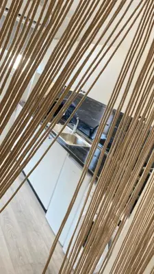 a view through a glass window of a table at Rhodes Beach Side Houses in Ixia