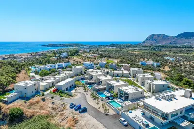 an aerial view of a resort near the ocean at Villa Trapezia Diamond in Kolimbia