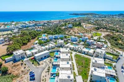 an aerial view of a resort near the ocean at Villa Trapezia Diamond in Kolimbia