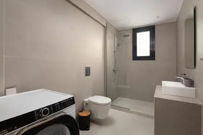 a bathroom with a shower and a toilet and a sink at Davlakos Apartments Rea in Kremasti