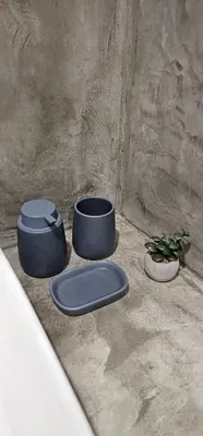three pots sitting on the ground with a plant at Spiti Studio City Center in Rhodes Town