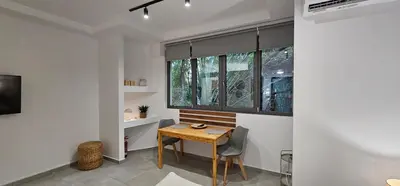 a dining room with a table and a window at Spiti Studio City Center in Rhodes Town