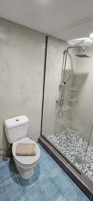 a bathroom with a toilet and a glass shower at Spiti Studio City Center in Rhodes Town