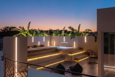 a balcony with lights on the side of a building at Hamilton Elite Penthouse in Rhodes Town