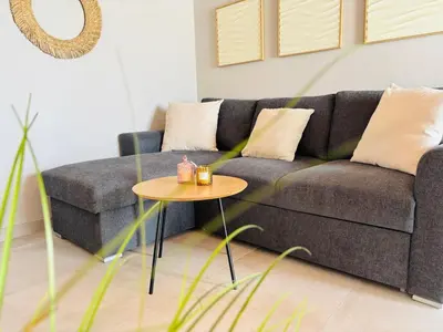 a living room with a couch and a table at Maison de Léa in Sálakos