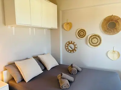a room with a bed with stuffed animals on it at Maison de Léa in Sálakos