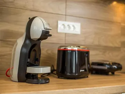 a coffee maker and toaster sitting on a counter at 2-Bedroom Villa with Private Pool in Kalithies in Faliraki