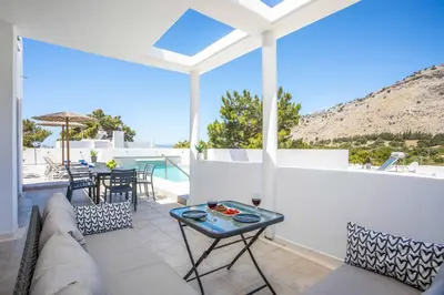 a living room with a couch and a table at Aggelina Pefkos in Pefki Rhodes