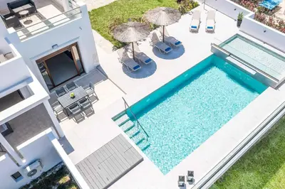 an overhead view of a swimming pool next to a house at Aggelina Pefkos in Pefki Rhodes