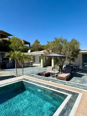 a swimming pool in the backyard of a house at Casa Loma 2 in Rhodes Town