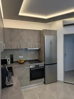 a kitchen with a stainless steel stove and refrigerator at Casa Loma 2 in Rhodes Town