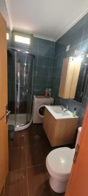 a bathroom with a toilet and a shower and a sink at Villa Salachouri in Symi