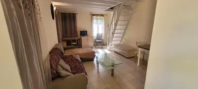 a living room with a couch and a table at Villa Salachouri in Symi