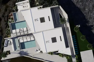an overhead view of a white house with palm trees at Monte Smith Aether & Aura Villas in Ixia