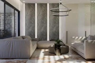 a living room with a couch and a chandelier at Monte Smith Aether & Aura Villas in Ixia