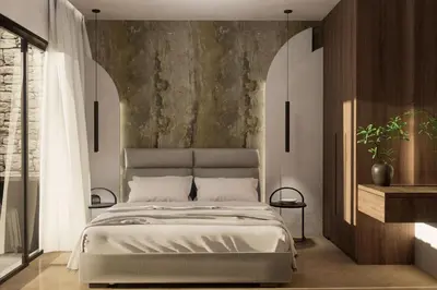 a bedroom with a bed and a wall at Monte Smith Aether & Aura Villas in Ixia