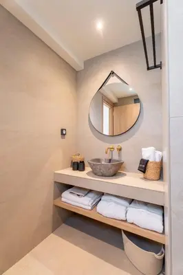 a bathroom with a sink and a mirror at Naiades Guest House in Sálakos