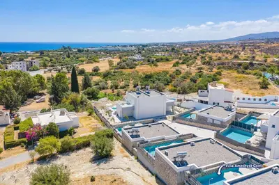 an aerial view of a house with a swimming pool at Villa Amethyst Gem by Villa Plus in Gennadi