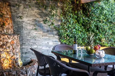 a table with fruit on it on a patio at La Casa Di Kika in Malona Village