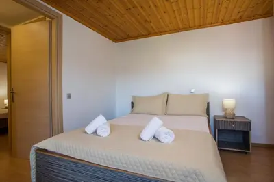 a bedroom with a bed with two pillows on it at La Casa Di Kika in Malona Village