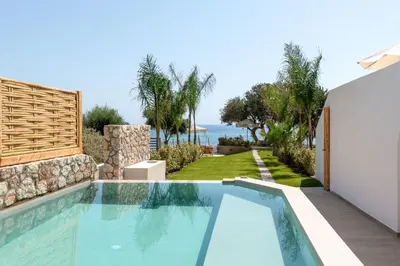 a swimming pool in a villa with a view of the ocean at Kivotos Blue villa in Lardos