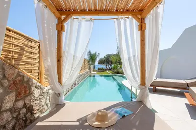 a villa with a swimming pool and a patio at Kivotos Blue villa in Lardos