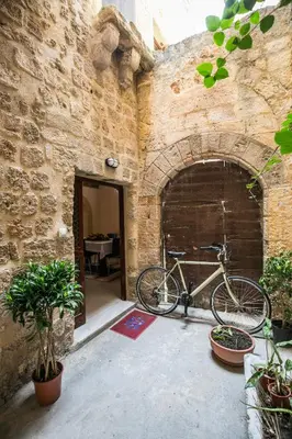 a bike is parked in a brick wall at Evdokia Old Town Hotel in Rhodes Town