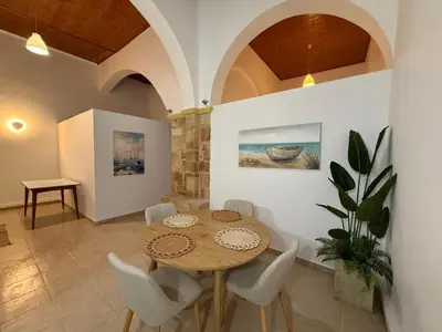 a dining room with a table and chairs at Evdokia Old Town Hotel in Rhodes Town