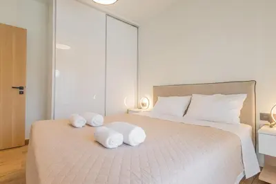 a bedroom with a large bed with towels on it at Marizaf house in Émbonas