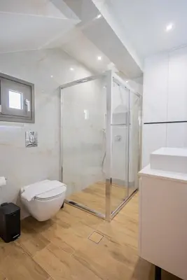 a bathroom with a shower and a toilet and a sink at Marizaf house in Émbonas