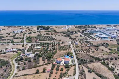an aerial view of a house and the ocean at Piccolo Paradiso Villas in Gennadi