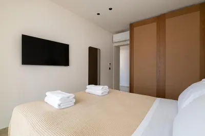 a bedroom with a bed with towels on it at Villa Celestia in vlicha