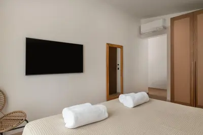a bedroom with two white towels on a bed at Villa Celestia in vlicha