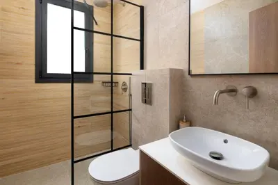 a bathroom with a white sink and a toilet at Villa Celestia in vlicha