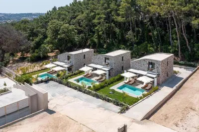 an aerial view of a house with a swimming pool at Rokas Luxury Villas in Asgourou