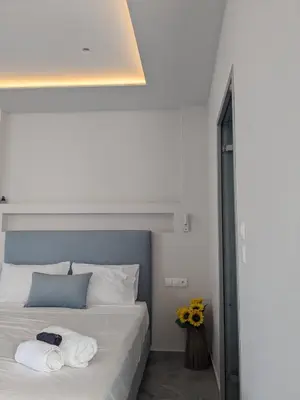 a bedroom with a bed with towels on it at Nirea Tree View Studio in Faliraki